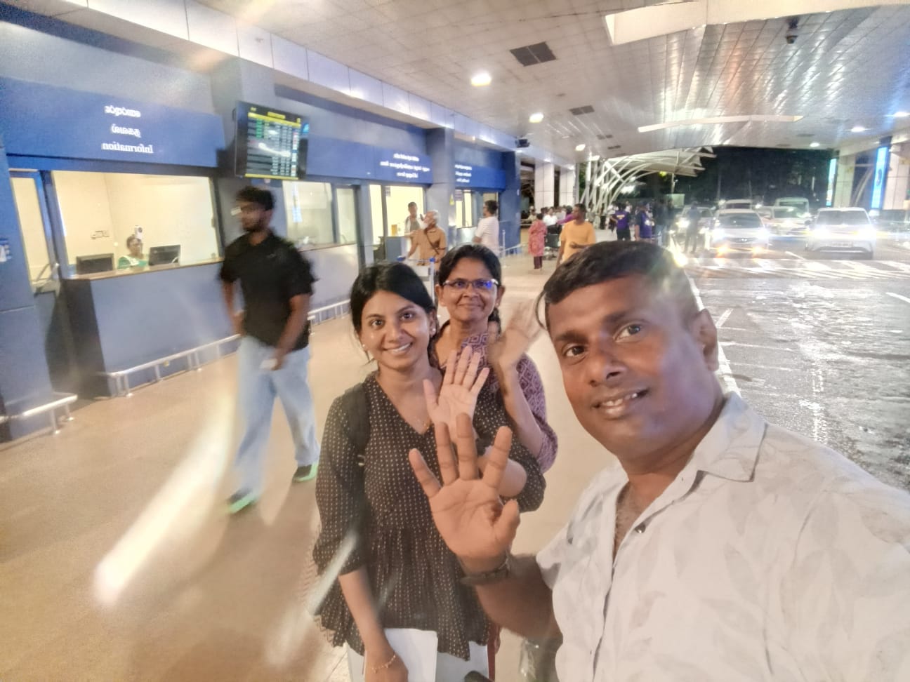 Alice's group saying goodbye at the airport before departure